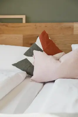 Ein Bett oder Betten in einem Zimmer der Unterkunft biYou Ecoquartier in den Bergen