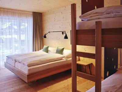 Ein Bett oder Betten in einem Zimmer der Unterkunft Kinderhotel Stegerhof