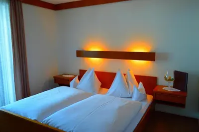 Ein Bett oder Betten in einem Zimmer der Unterkunft Hotel Kristall