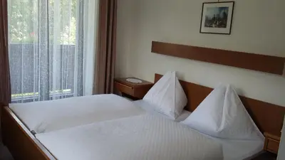 Ein Bett oder Betten in einem Zimmer der Unterkunft Hotel Kristall