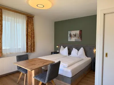 Ein Bett oder Betten in einem Zimmer der Unterkunft Hotel Seerose Wolfgangsee