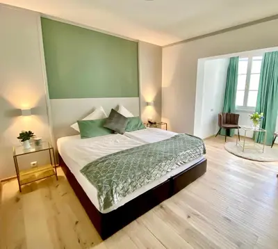 Ein Bett oder Betten in einem Zimmer der Unterkunft Boutiquehotel Hubertushof