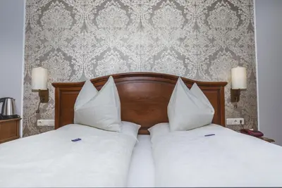 Ein Bett oder Betten in einem Zimmer der Unterkunft Villa Anzengruber