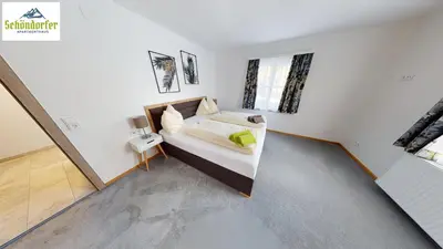 Ein Bett oder Betten in einem Zimmer der Unterkunft Apartementhaus Schöndorfer