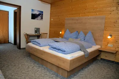 Ein Bett oder Betten in einem Zimmer der Unterkunft Pension Mitterwallner