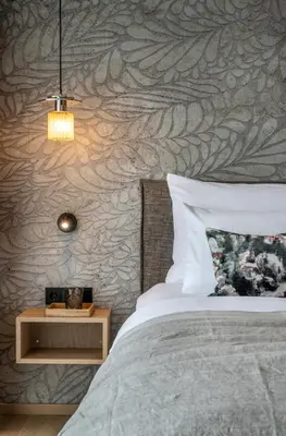 Ein Bett oder Betten in einem Zimmer der Unterkunft NEUWIRT - Boutiquehotel & Wirtshaus