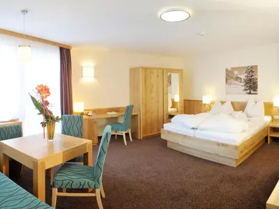 Ein Bett oder Betten in einem Zimmer der Unterkunft Panoramahotel Gürtl