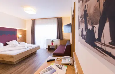 Ein Bett oder Betten in einem Zimmer der Unterkunft Panoramahotel Gürtl
