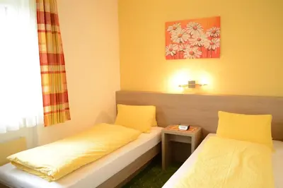 Ein Bett oder Betten in einem Zimmer der Unterkunft Apartmenthaus Oberlehen