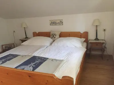 Ein Bett oder Betten in einem Zimmer der Unterkunft Ferienwohnung Am Sonnenhang
