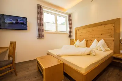 Ein Bett oder Betten in einem Zimmer der Unterkunft Apparthotel Panorama