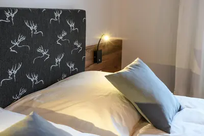 Ein Bett oder Betten in einem Zimmer der Unterkunft Das Talblick - Appartments