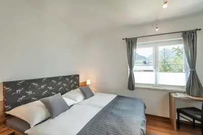 Ein Bett oder Betten in einem Zimmer der Unterkunft Das Talblick - Appartments
