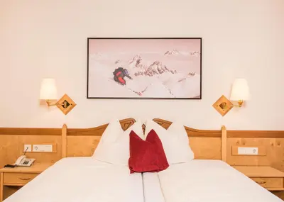 Ein Bett oder Betten in einem Zimmer der Unterkunft Hotel Zauchensee Zentral