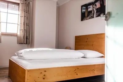 Ein Bett oder Betten in einem Zimmer der Unterkunft Pension Feichthub