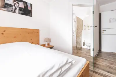 Ein Bett oder Betten in einem Zimmer der Unterkunft Pension Feichthub