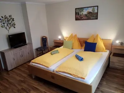 Ein Bett oder Betten in einem Zimmer der Unterkunft Haus Hubertusheim