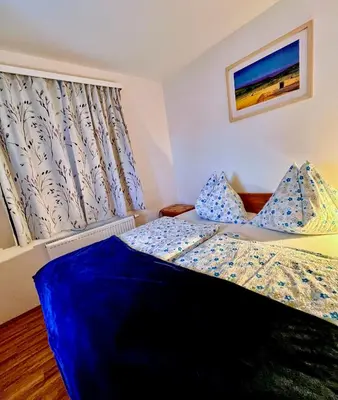 Ein Bett oder Betten in einem Zimmer der Unterkunft Obersdorfer Hof