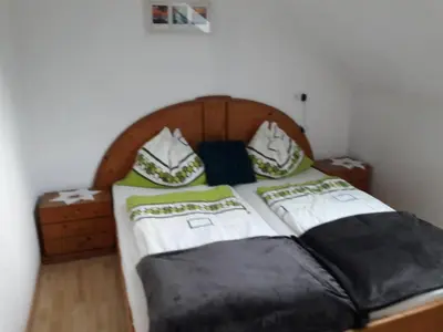 Ein Bett oder Betten in einem Zimmer der Unterkunft Ferienwohnung Brandstatter