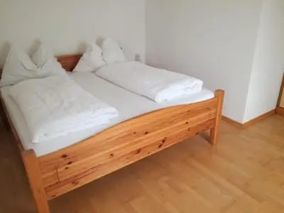 Ein Bett oder Betten in einem Zimmer der Unterkunft Gästehaus Lemmerer