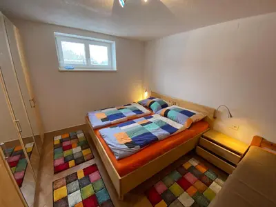 Ein Bett oder Betten in einem Zimmer der Unterkunft Ferienhaus Holiday