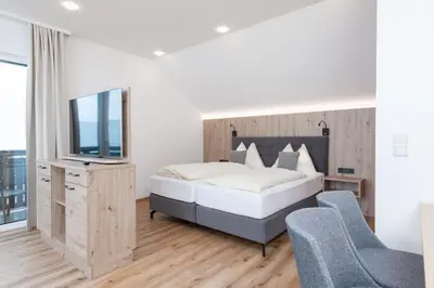 Ein Bett oder Betten in einem Zimmer der Unterkunft Hotel Schönberger