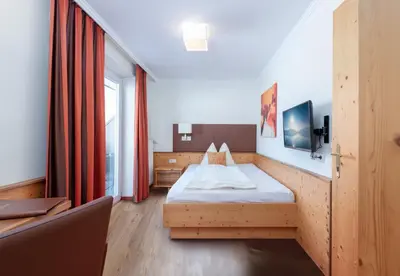 Ein Bett oder Betten in einem Zimmer der Unterkunft Hotel Schönberger