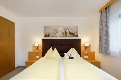 Ein Bett oder Betten in einem Zimmer der Unterkunft Haus Austria