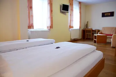 Ein Bett oder Betten in einem Zimmer der Unterkunft Landgasthof Buchner