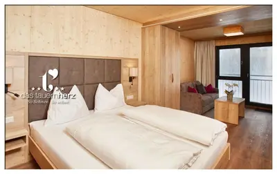 Ein Bett oder Betten in einem Zimmer der Unterkunft Das Tauernherz