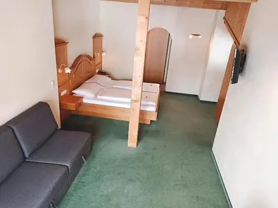 Ein Bett oder Betten in einem Zimmer der Unterkunft Hotel Grünwaldkopf