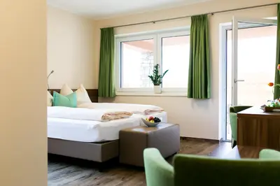 Ein Bett oder Betten in einem Zimmer der Unterkunft Hotel Aichingerwirt