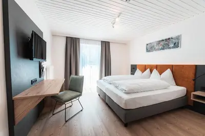 Ein Bett oder Betten in einem Zimmer der Unterkunft Landhotel Prielbauer