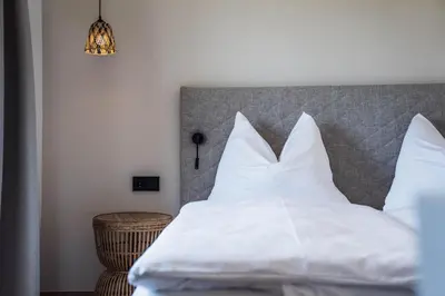 Ein Bett oder Betten in einem Zimmer der Unterkunft Bergrose Hideaway