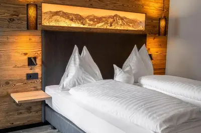 Ein Bett oder Betten in einem Zimmer der Unterkunft DAS Hintersee
