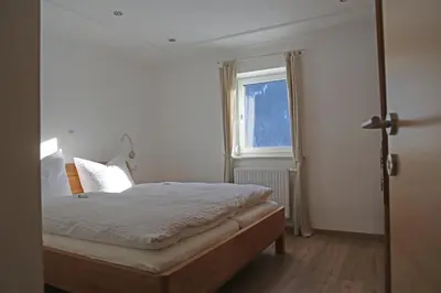 Ein Bett oder Betten in einem Zimmer der Unterkunft Ferienwohnungen Hager