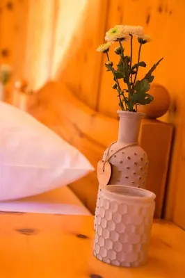 Ein Bett oder Betten in einem Zimmer der Unterkunft Zirbenchalet Eggriedl