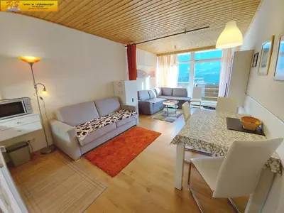 Ein Sitzbereich in der Unterkunft Apartment Grimmingblick