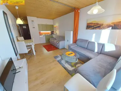 Ein Sitzbereich in der Unterkunft Apartment Grimmingblick
