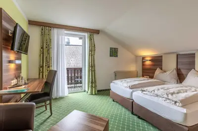 Ein Bett oder Betten in einem Zimmer der Unterkunft Hotel Post by keyone