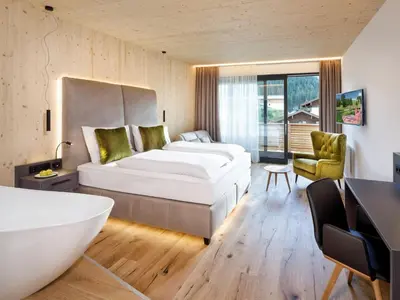 Ein Bett oder Betten in einem Zimmer der Unterkunft Das KATSCHBERG Superior