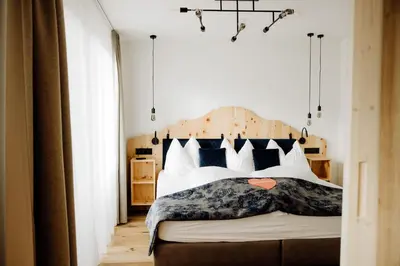 Ein Bett oder Betten in einem Zimmer der Unterkunft Das KATSCHBERG Superior