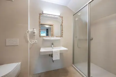 Ein Badezimmer in der Unterkunft Aparthotel am Reitecksee