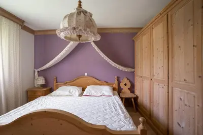 Ein Bett oder Betten in einem Zimmer der Unterkunft Rekreacni dum Grimming