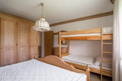 Ein Bett oder Betten in einem Zimmer der Unterkunft Rekreacni dum Grimming