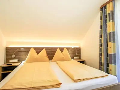 Ein Bett oder Betten in einem Zimmer der Unterkunft Apartment Gipfelkreuz by Interhome