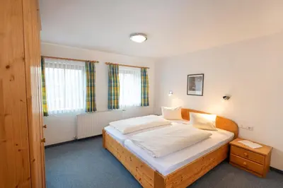 Ein Bett oder Betten in einem Zimmer der Unterkunft Ferienhof Nasnergut