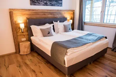 Ein Bett oder Betten in einem Zimmer der Unterkunft Lungauer Baerensuiten