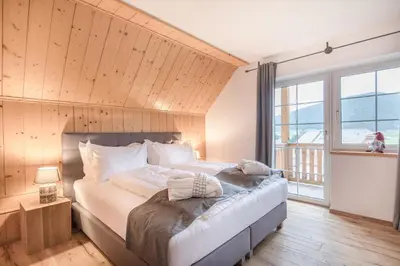 Ein Bett oder Betten in einem Zimmer der Unterkunft Lungauer Baerensuiten