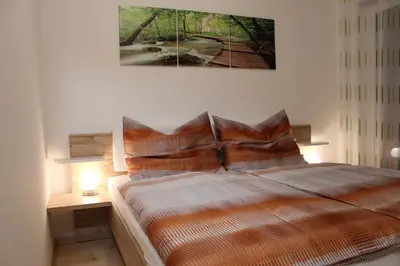 Ein Bett oder Betten in einem Zimmer der Unterkunft Familienapartment Sunnseitn